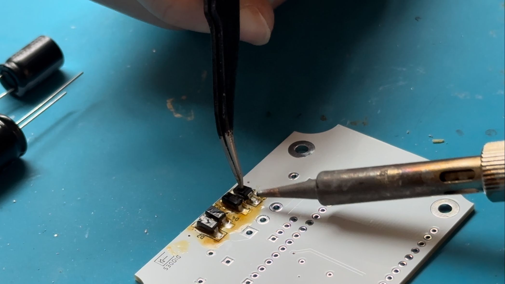 Me soldering the diodes on the back of the PCB