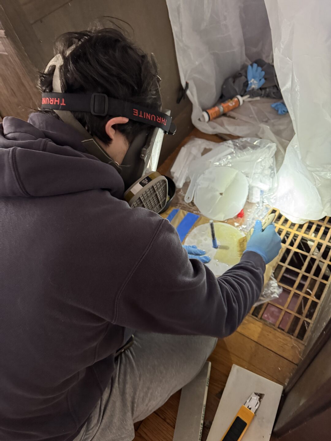 Wetting the bottom layers of fiberglass