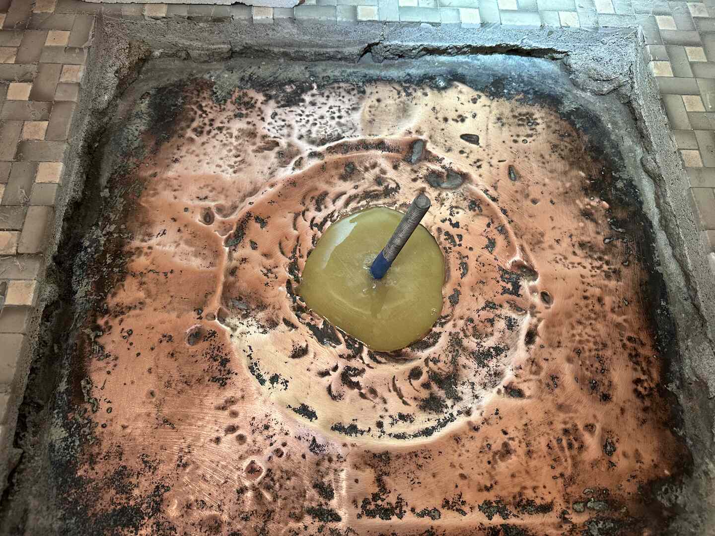 Shower pan from above with the bottom layer of fiberglass applied