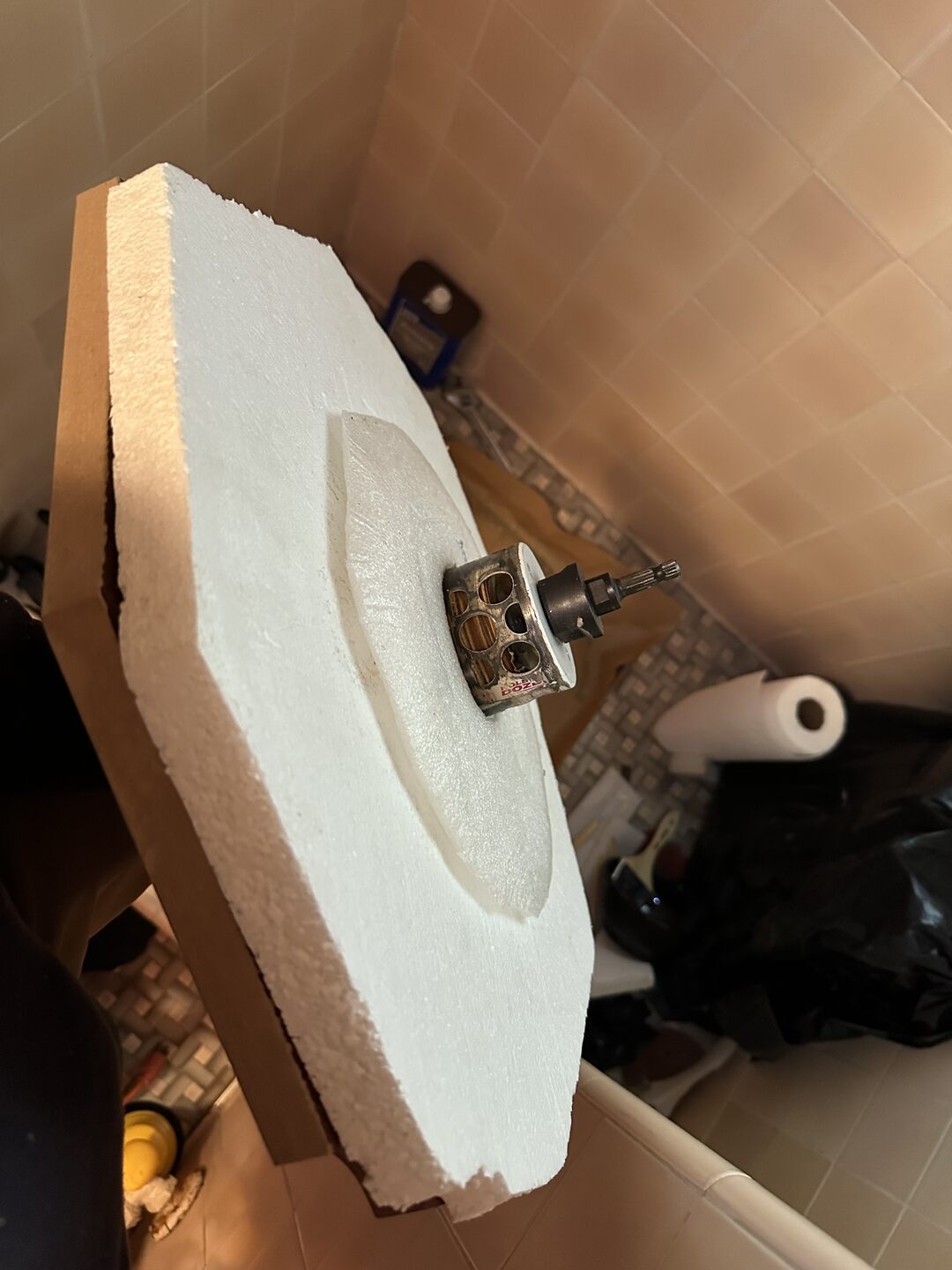 Top clamp removed with hole saw still attached