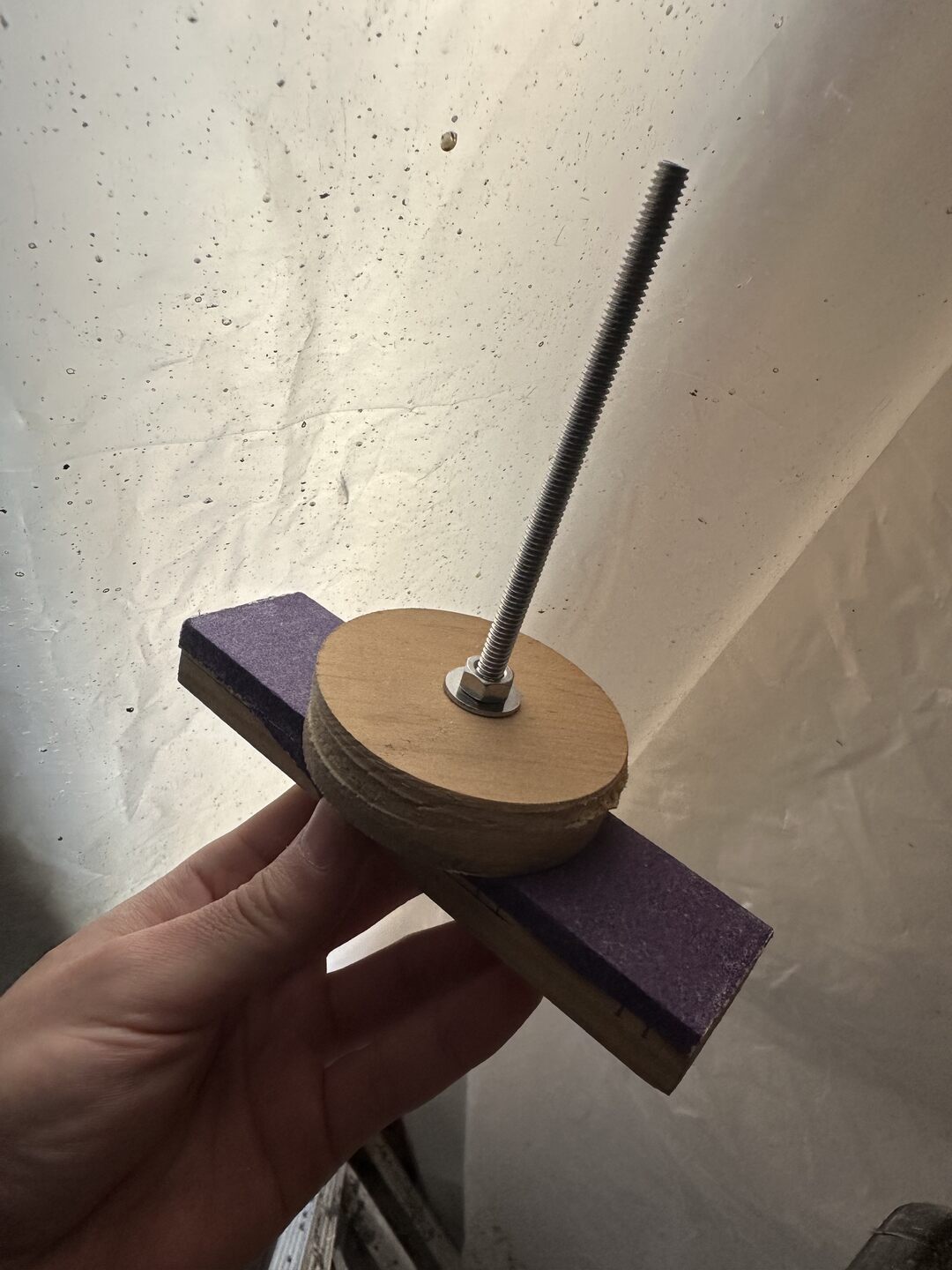 Sanding tool for smoothing out the bottom of the patch