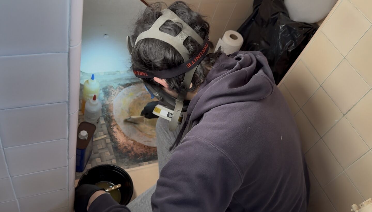 Wetting out the top layers with a brush